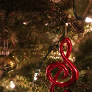 Christmas tree with treble clef ornament and fairy lights.
