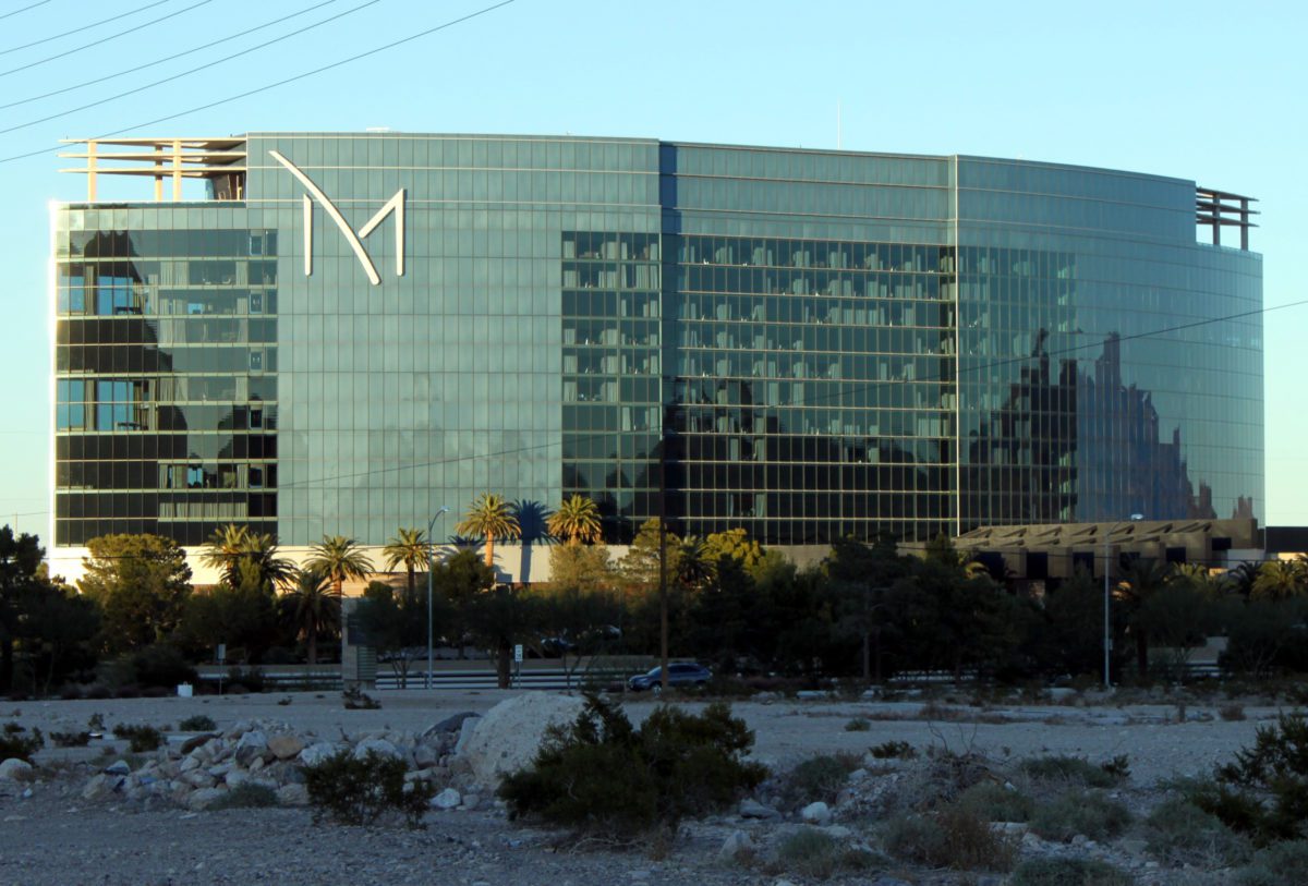 The M Resort Las Vegas, a large, curved building with glass windows covering the exterior.