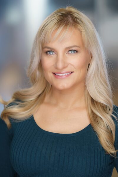 Amy Lawrence, choreographer, studio headshot in a neutral top.