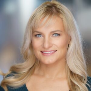 Amy Lawrence, choreographer, studio headshot in a neutral top.