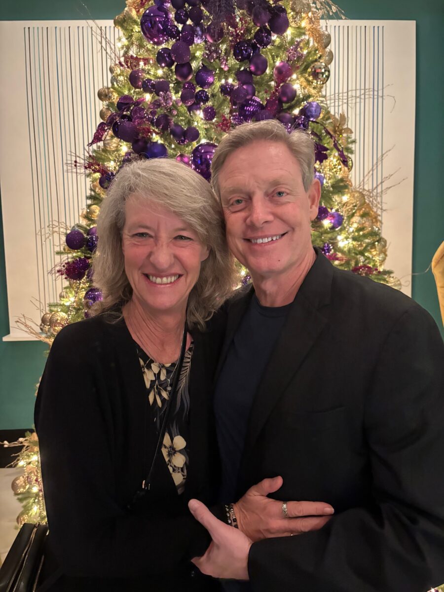 David and Sarah Mantay stand in front of their Christmas tree.