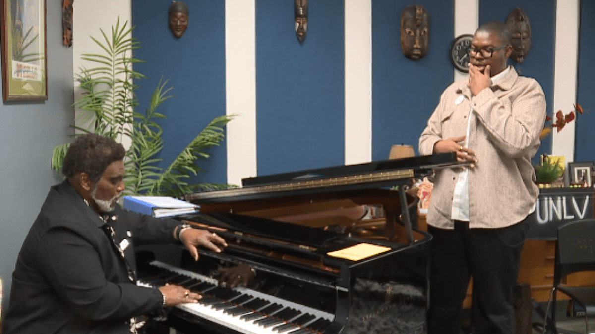 UNLV's Dr. Alfonse Anderson and student Christian Shelton rehearse at a grand piano.
